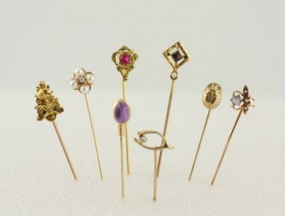Group Of Antique Stickpins: Comprising antique pin with ruby, antique moonstone and pearl pin, 14K pearl and diamond pin, 14K scarab, Art Deco garnet and pearl pin (illegible markings), 14K cabochon amethyst, wishbone and diamon