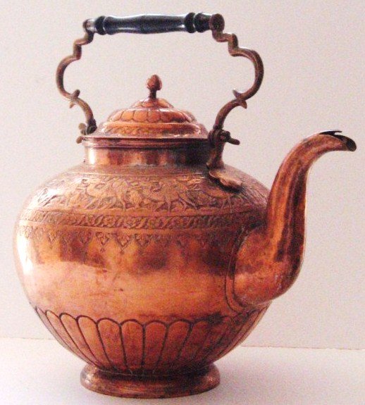 Antique Persian Copper Tea Kettle: Having a brass and wood handle, probably circa late 19th century. H. 17 1/2 inches. Very good condition.