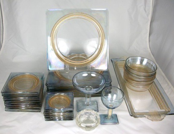 Rare Baccarat Dinner Service: Extremely unusual and rare irridescent Baccarat crystal dinner service with gilt highlights, comprising 10 dinner plates (9 inches square), 10 smaller plates (4 3/4 inches square), 8 wines (H. 4 1/2 i