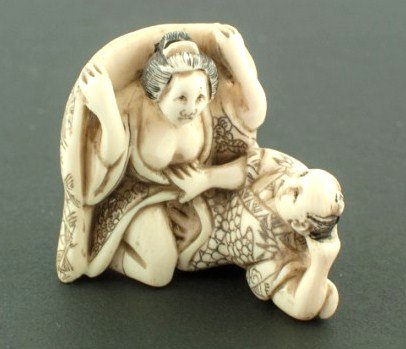 Carved Ivory Erotica Netsuke: 1 5/8 x 1 3/8 inches. Signed. Circa early 20th century.