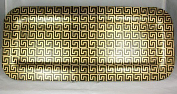 Fornasetti Tray, Circa 1960: Black and gold Greek fret (or Greek key) design. Original Fornasetti paper label on reverse. L. 23 1/8 inches. W. 9 5/8 inches. Excellent condition.