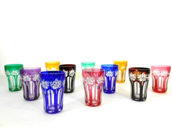 Group Of Cut Glass Tumblers: Group of 11 European cut glass tumblers, various colors. H. 4 1/2 inches. Very good condition.