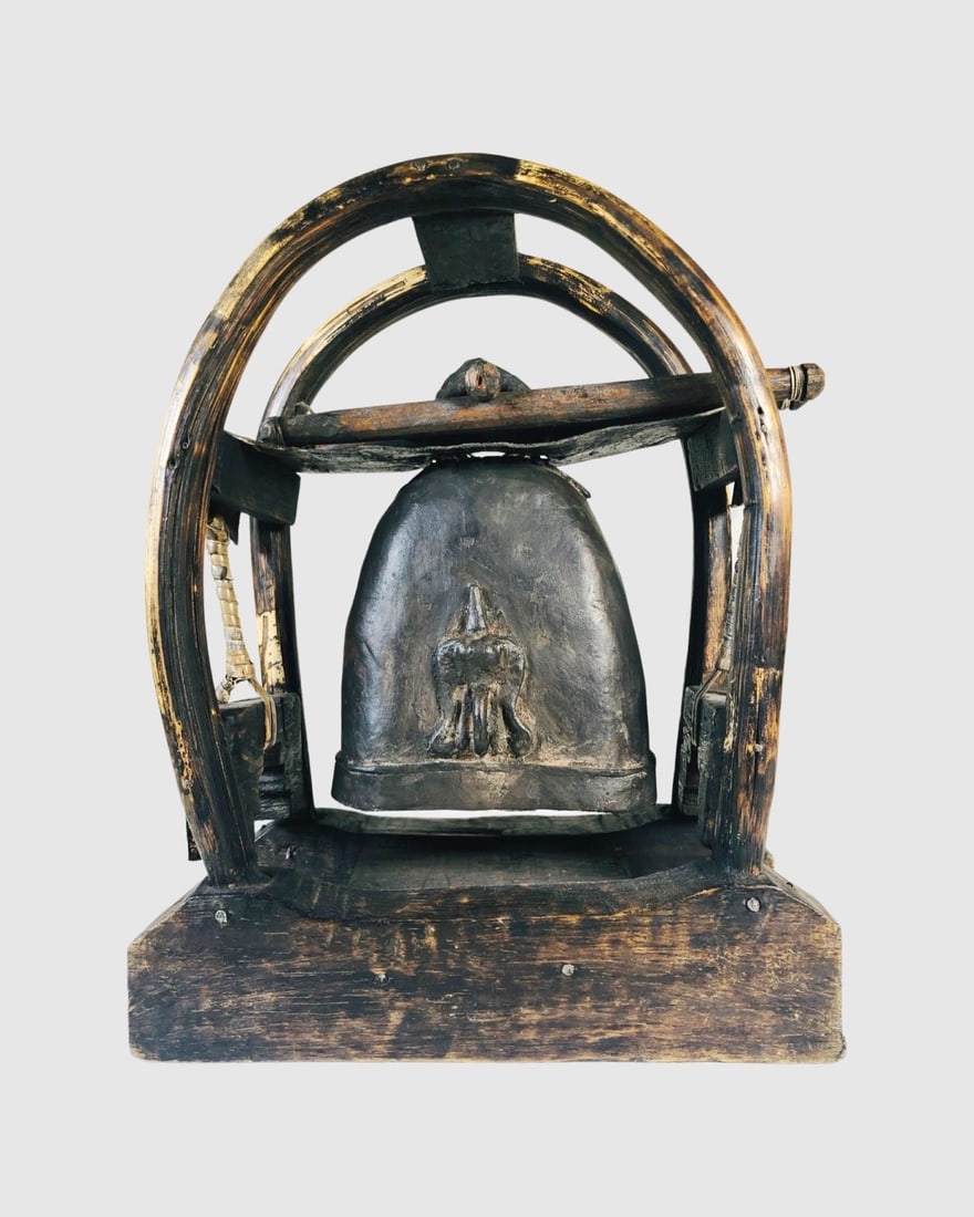 Antique Tibetan Buddhist Bronze Bell: Antique Tibetan Buddhist bronze bell with stand. The bell, circa 19th century or earlier; the stand probably of a later date. H. 10 1/2 inches W. 9 inches D. 4 inches