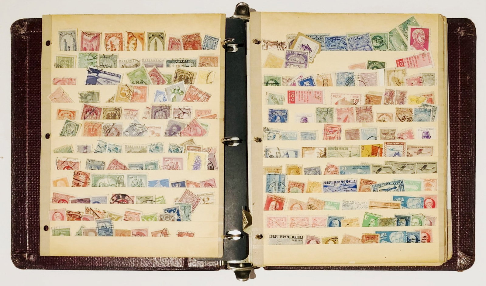 Binder With Collectible Old Stamps: Old binder with stock sheets of old U.S. and world postage stamps. Removed from a recently deceased estate.