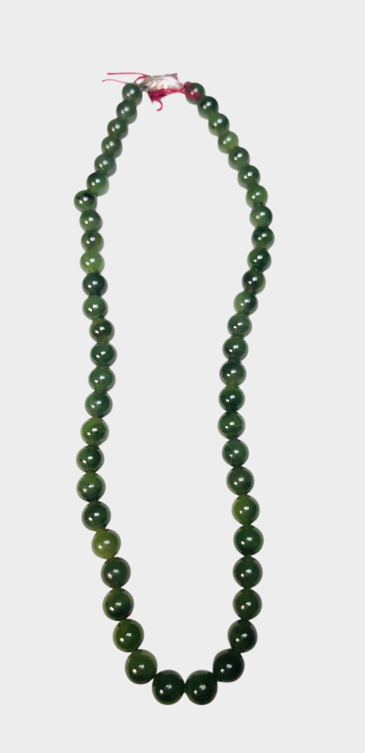 Chinese Green Jade Necklace: Chinese green jade bead necklace, mid-20th century. L. (approx) 16 inches