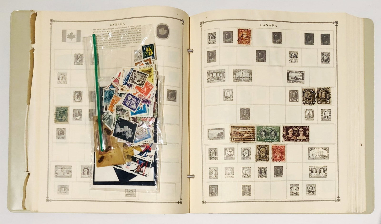 Two Binders With Collectible Old Postage Stamps: Stamp album and binder with collectible old U.S. and world postage stamps. Removed from a recently deceased estate.