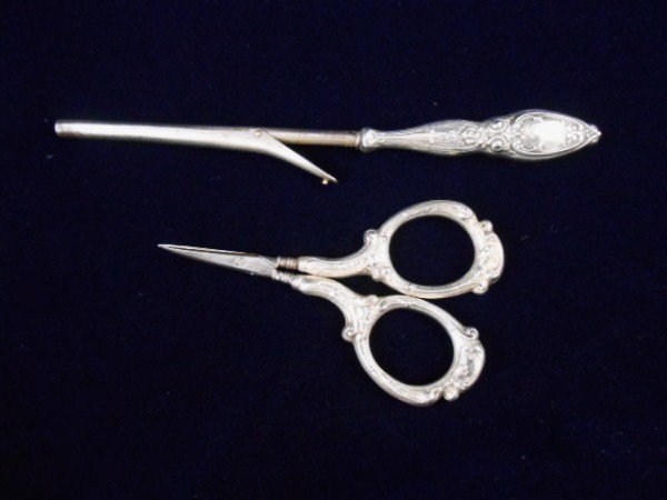 Two Sterling Silver Vanity Items: Scissors and child's hair curler. Both marked sterling (handles only). Probably circa 1900-1920.