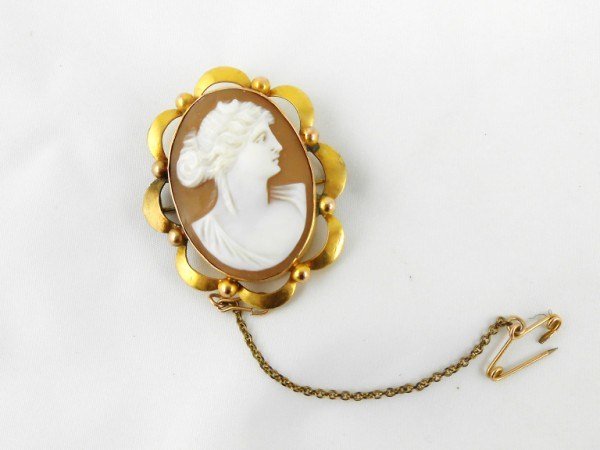 Vintage Cameo Set In 9 KT Gold Bezel: Well-carved antique cameo brooch, 9KT yellow gold, probably English, circa 1890. L. 1 1/2 inches. Very good condition.