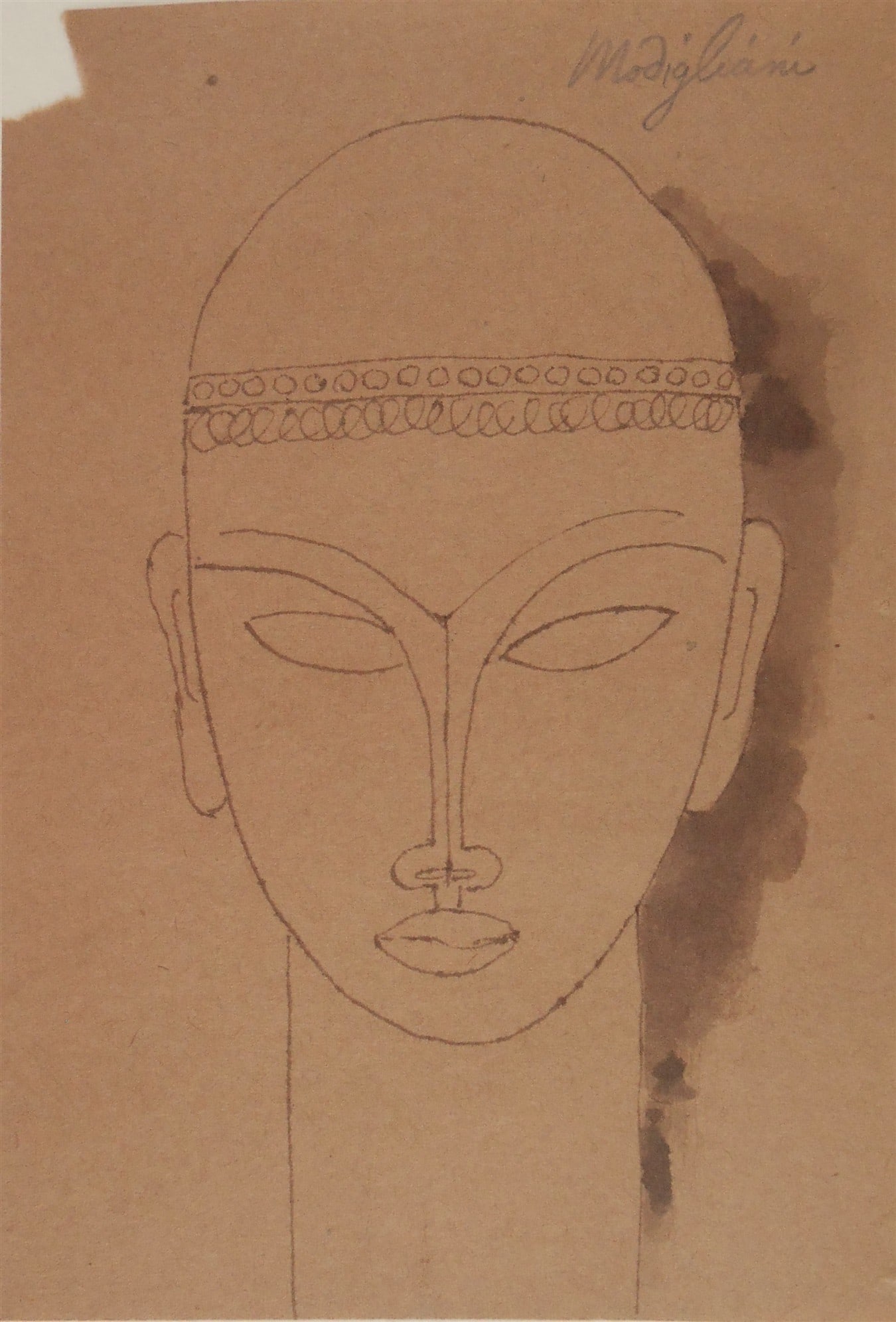 Amedeo Modigliani* (1884-1920) Ink Drawing (See Guarantee & Disclaimer): Brown ink drawing with ink wash on brown wove paper, Tete de face, signed (Amedeo Modigliani*, 1884-1920). Good condition overall, small paper loss upper left hand corner. A very finely executed drawi