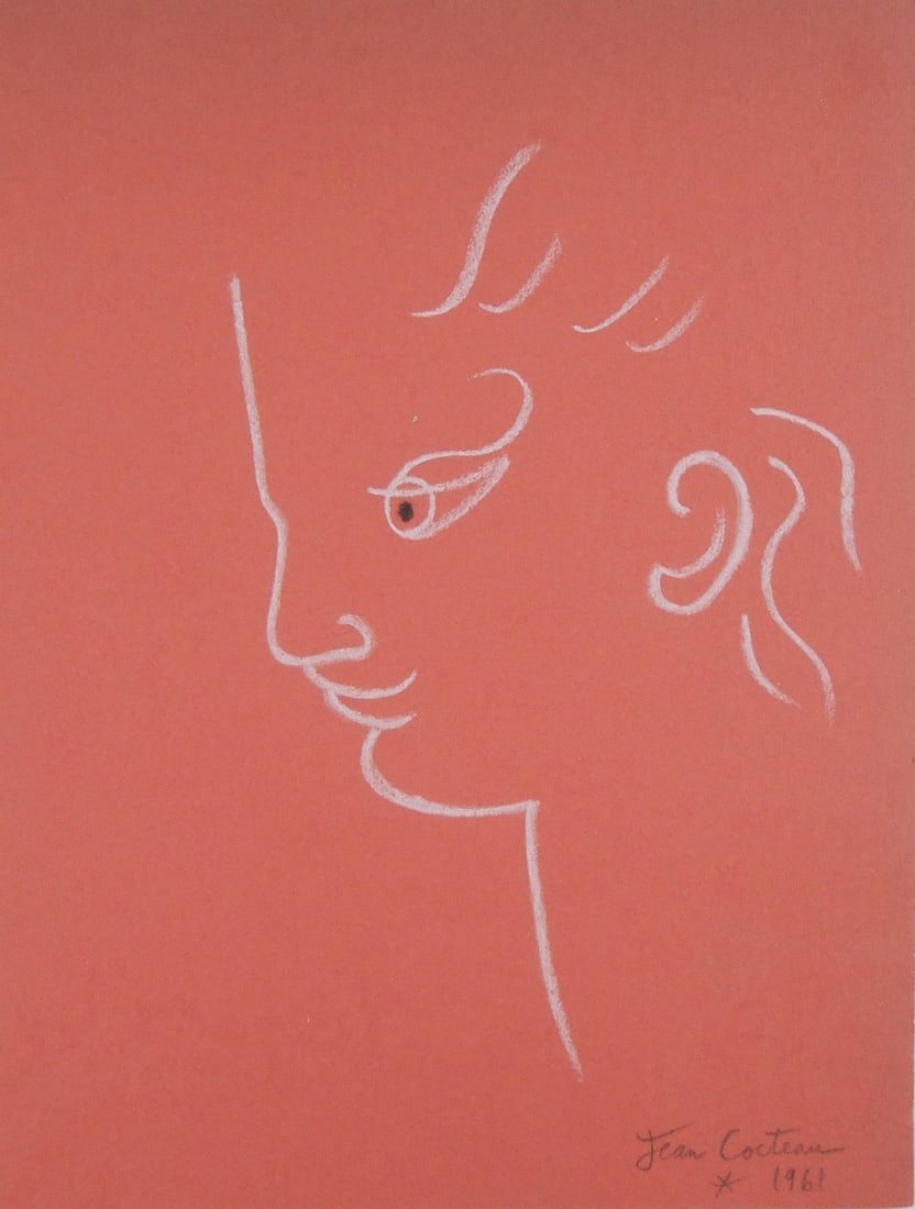 Jean Cocteau* (1889-1963) White Chalk Drawing (See Guarantee & Disclaimer): White chalk drawing on orange paper, face in profile, signed (Jean Cocteau*, 1889-1963). Very good condition overall. No evidence of any damage or repairs. Removed from frame for inspection, photograp