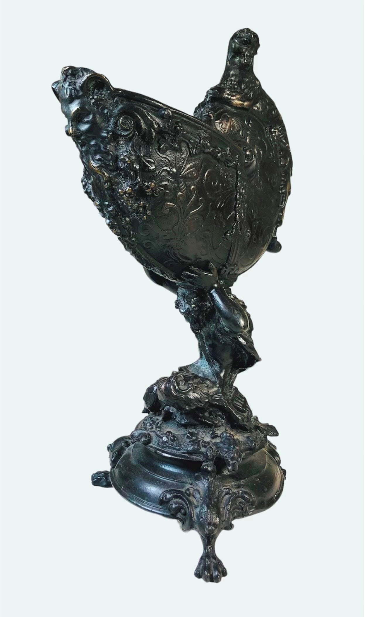 Roman Revival Bronze Wine Porringer, 19th Century: Roman Revival bronze wine porringer, depicting a Satyr shouldering a nautilus shell. Unsigned. Circa mid-late 19th century. Very good condition. Dimensions: H. 13 inches W. 6 inches D. 8 inches