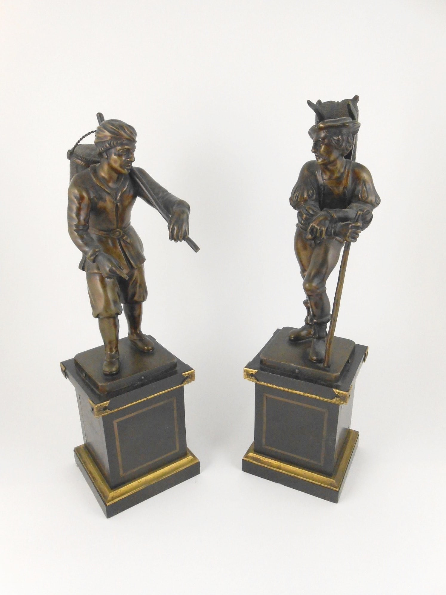 Pair Of Bronze Figures, 18th Century: Fine pair of European bronze figures, travelers or vagabonds, possibly French, circa 1750-1800. Each figure raised on a bronze-mounted and inlaid square wooden plinth. Very good condition. H. 13 inche