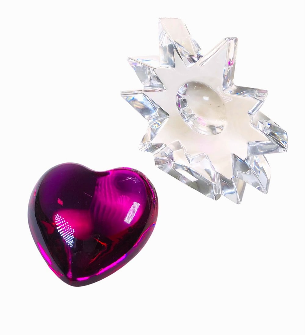 Two Pieces Of Baccarat Crystal: Two pieces of Baccarat crystal, the first, a pinkish-red crystal "Amor" heart (retails @ $620), the second, a crystal star. Both signed and in excellent condition. Circa late 20th century.Dimensions