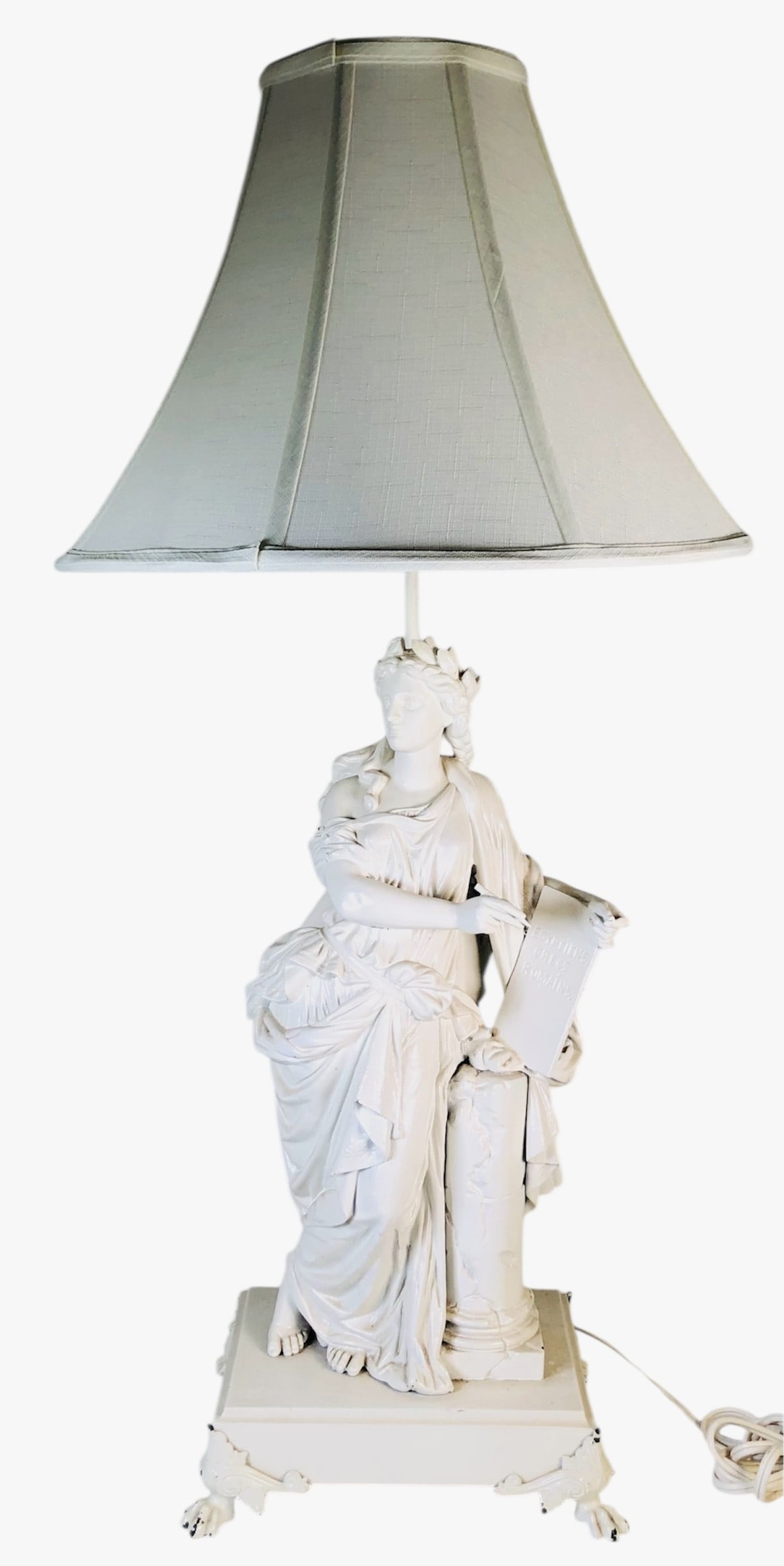 Neoclassical Figural Table Lamp: Figural table lamp featuring a neoclassical draped maiden holding a tablet (Egyptiens Grecs Romains) representing knowledge and history, The white-painted metal figure, probably circa late 19th centur
