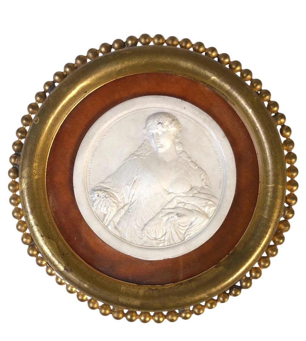 19th Century Framed Plaster Intaglio: Beautiful plaster intaglio featuring a maiden in flowing robes, probably Italian, circa mid-19th century. Gilt-metal frame. Very good condition.Dimensions: Dia. (including frame) 4 1/2 inches