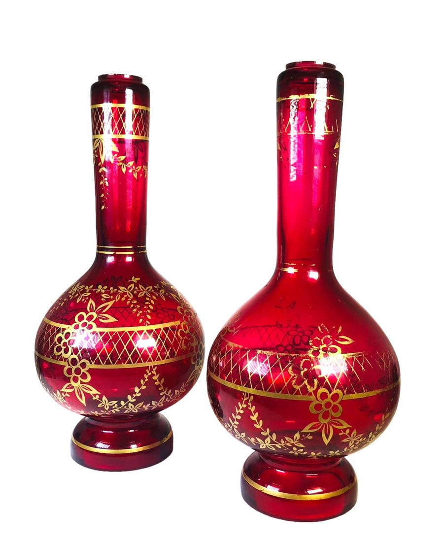 Bohemian Glass Lamp Bases, Circa 1920: Pair of large Bohemian red (ruby) glass lamp bases with floral motifs in parcel gilt. Very good condition. Dimensions: H. 16 inches Dia. 7 inches Weight: 10 1/4 pounds