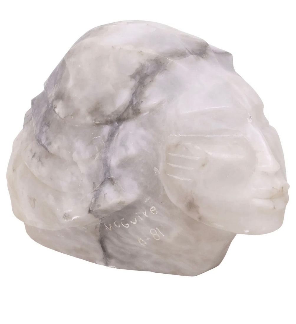 Frank McGuire (B. 1938) Sculpture, Signed, 1981: Carved alabaster sculpture of a female head by Frank McGuire (b. 1938). Signed and dated ('81). Excellent condition. Dimensions: H. 13 1/2 inches W. 14 inches D. 19 1/2 inches Provenance: Private coll