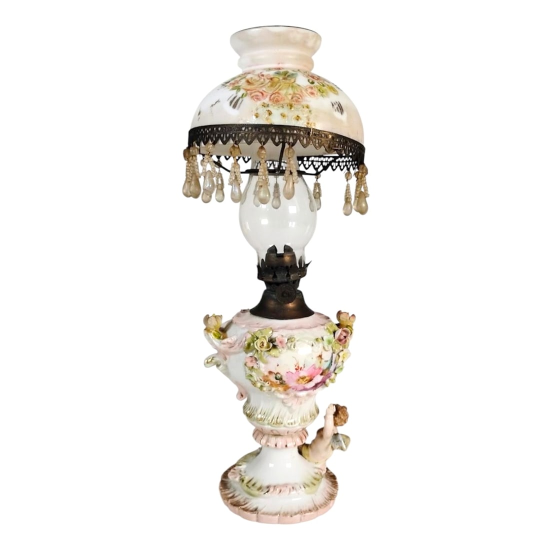 Antique Miniature Porcelain Oil Lamp: Miniature porcelain oil lamp, probably German, circa early 20th century. Very minor chips to a couple of the porcelain flowers, otherwise very good condition. Dimensions: H. (including glass chimney) 
