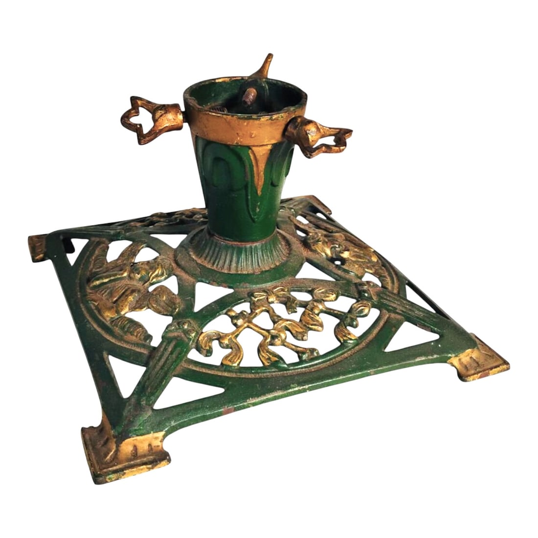 Antique Cast Iron Christmas Tree Stand: Antique cast iron Christmas tree stand. Green and gold paint finish (worn in areas). Very good condition overall. Dimensions: L. 9 inches W. 9 inches H. 5 inches