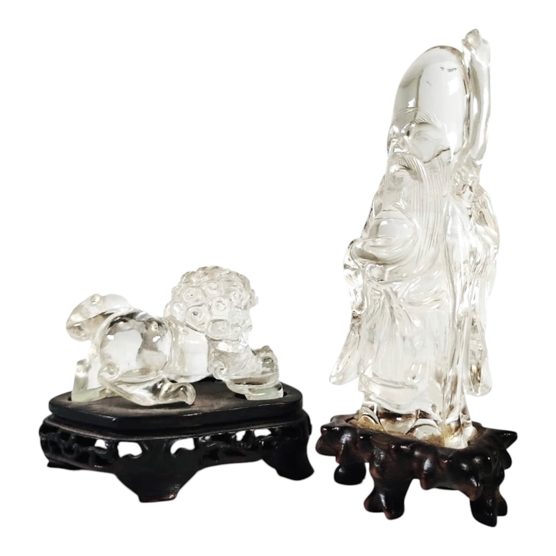 Chinese Rock Crystal Figures On Stands (2): Two Chinese carved rock crystal figures on stands, standing wise man and a foo lion. Excellent condition. Dimensions: Wiseman - H. (including stand) 4 3/4 inches W. 2 inches Foo Lion - H. (including s