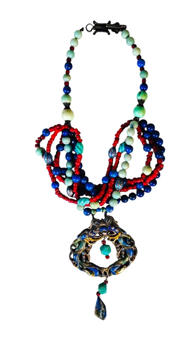Nepalese Silver Necklace: Silver or silvered metal necklace and large pendant with coral, lapis, turquoise, etc. Circa mid-20th century. Very good condition. Dimensions: L. 17 inches Provenance: Estate of a prominent Highland 