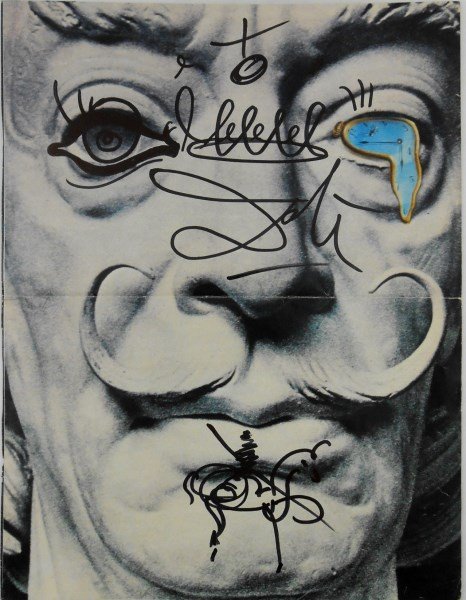 Salvador Dali (1904-1989) Magazine Drawing: Magazine page, probably circa 1970's, decorated with drawings in black felt-tip pen by/attributed to Salvador Dali (1904-1989). Boldly signed across an image of the artist's face. Very good condition 