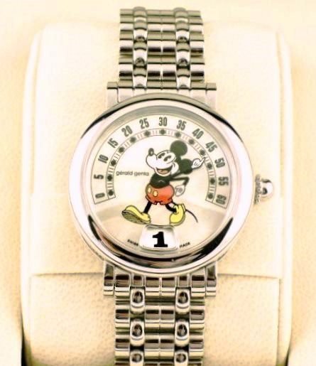 Gerald Genta Jump Hour Mickey Mouse Watch: Gerald Genta fantasy retro jump hour Mickey Mouse watch. Polished stainless steel case (33mm dia.), automatic movement, original box, papers, etc. Excellent condition.