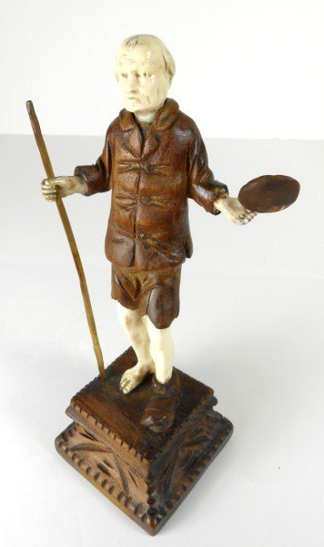 European Carved Ivory Peasant Figure, 19th C.: Well-carved European ivory figure of a peasant wearing one shoe and carrying a staff and bowl, circa early 19th century. Raised on a carved wooden plinth. H. (figure only) 6 inches.