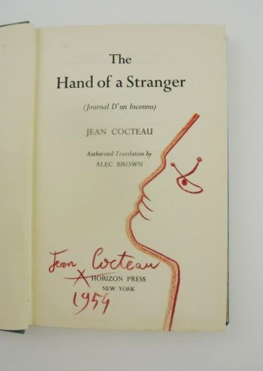 Jean Cocteau (1889-1963) Colored Pencil Drawing: Colored pencil drawing, untitled (face in profile), by/attributed to Jean Cocteau (1889-1963). Signed and dated 1959. Executed on the title page of "The Hand of a Stranger," by Jean Cocteau, printed i