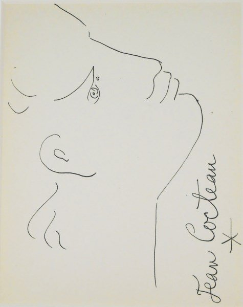 Jean Cocteau (1889-1963) Ink Drawing: Pen and ink drawing, face in profile, by/attributed to Jean Cocteau (1889-1963). Signed along the right hand edge. 10 1/4 x 7 7/8 inches. Excellent condition. Hinged and matted. AUTHENTICATION AND PRO