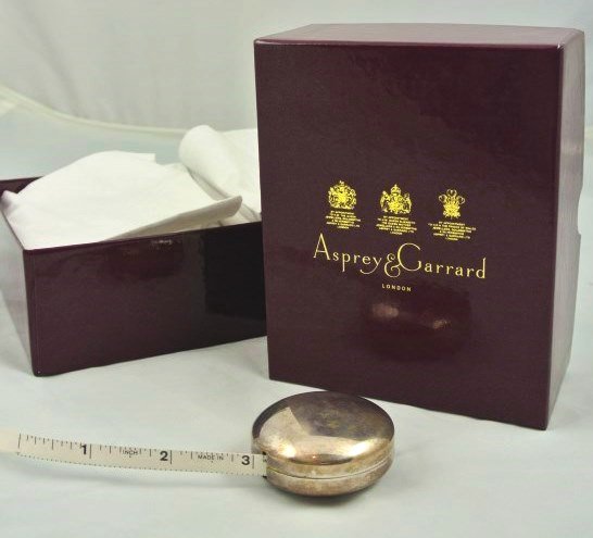 Asprey Sterling Silver Tape Measure: Asprey & Garrard sterling silver tape measure with original Asprey box and documents. Diameter 2 inches. Hallmarked. Excellent condition.