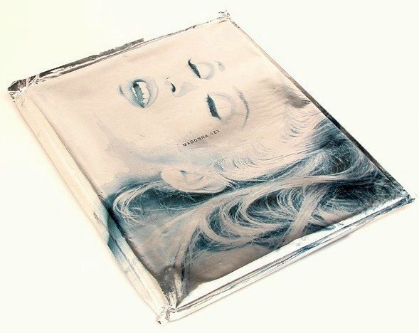 Madonna "Sex" Book: Madonna's "Sex" book. Excellent condition, never opened."Sex" is a coffee table book written by Madonna, with photographs taken by Steven Meisel Studio and film frames shot by Fabien Baron. The book w