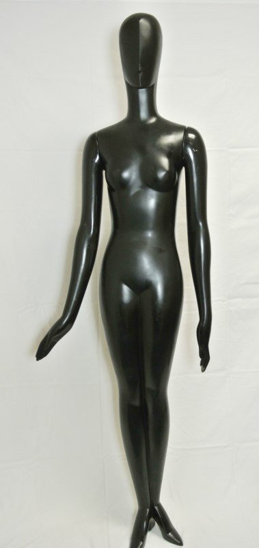 Four YSL Mannequins: Group of four mannequins from YSL, each painted black. One figure has a damaged hand. There are also some minor paint losses, otherwise very good condition overall. H. 73 inches.