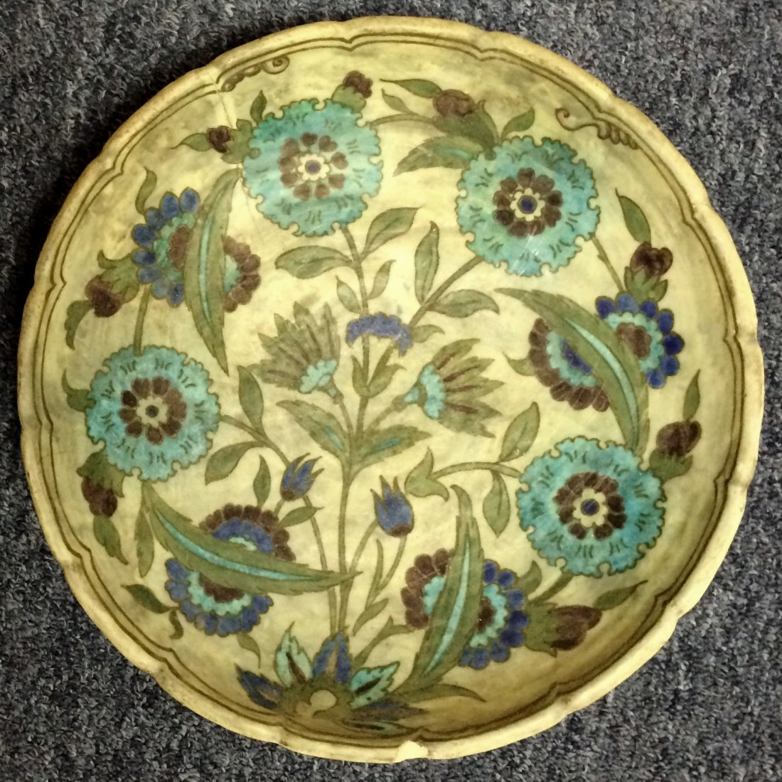 Persian Or Turkish Ceramic Bowl, 18th C. Or Earlier: Persian (or possibly Turkish) ceramic bowl, circa 18th century or earlier, having a scalloped rim and decorated with stylized flowers and foliage in shades of blue and green. Chips to underneath rim, 