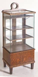 Oak Display Case: Display case, circa 1920's. Glass front and side display case with oak case resting on legs. Three adjustable shelves. Two mirrored back doors and two hinged drop doors. 21w x 15d x 55h