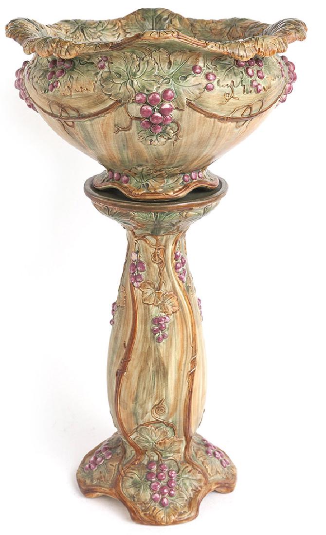 Weller Jardinaire with Pedestal: Hand painted on high molded relief vintage pattern, muted earth tone glazes, stamped "Weller" on each pieces, 18" diameter x 33" high.