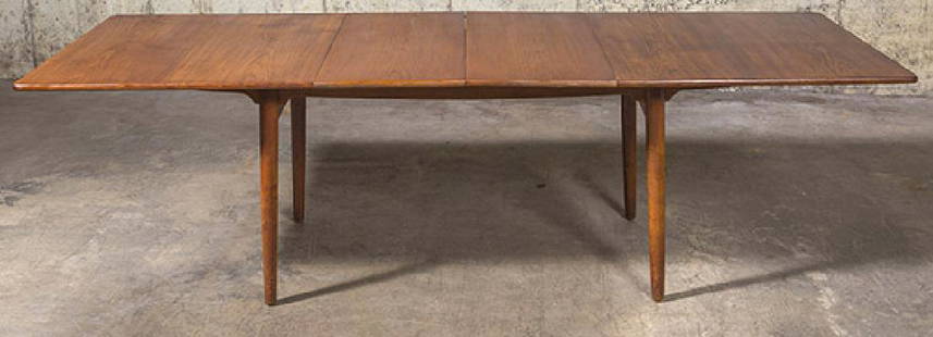 Hans J. Wegner Dining Table: Designed by Hans J. Wegner and made in Denmark by Andreas Tuck Furniture Makers. Table features two 19.5 inch leaves. Table measures 94 inches when fully extended. Model AT312 Andreas Tuck Denmark, C.