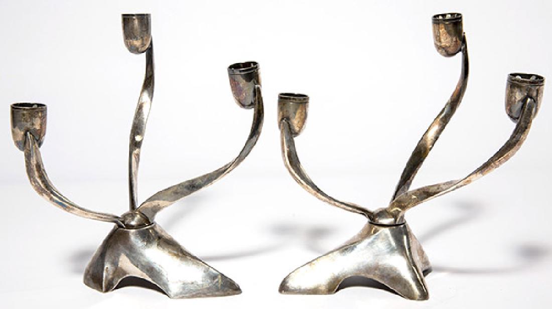 Robert H. Ramp Candelabrums: Rotating Candelabrums, pair. Reed and Barton, 1950/ Silver-plate. Manufacturer's mark to each and numbered 880 7"w x 5"d x 8 1/4H