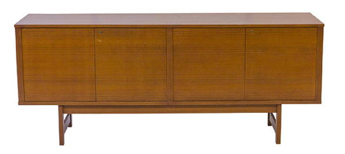 Svend Langkilde Credenza: Credenza. Sold by Illums Bolighus. Denmark, 1960's. Teak and brass. Four doors and interior drawers. 75w x 17 3/4d x 30 7/8h.