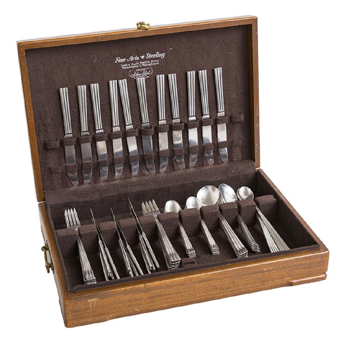 Folke Arstrom "Thebe" Pattern Flatware: Flatware. Gense, Sweden. 1940's. Complete seven piece service for 8., plus extra pieces. 76 total pieces. 10 dinner forks, 8 ice tea spoons, 11 dinner knives, 12 butter knives, 11 salad forks, and 12