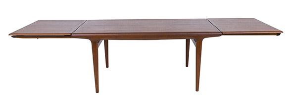 Niels O. Moller Dining Table: Extension dining table. J.L. Mollers Mobel Fabrik. Two Twenty-five inch leaves. Manufactures mark stamped to underside. Teak. 116w x 35d x 28 1/2h.