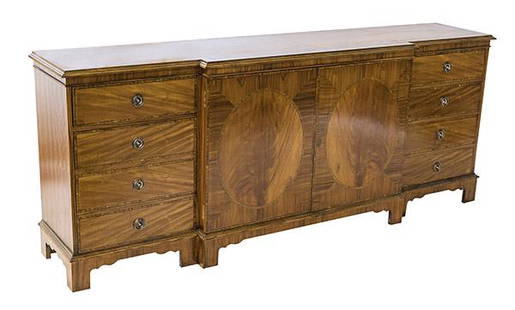 Book Matched Mahogany Veneered Credenza: Large mahogany credenza with maple string inlay with two center door with book matched veneer flanked by four drawers to each side. Fine shaped aprons with ogre bracket legs. 85 1/4w x 18 d x 34