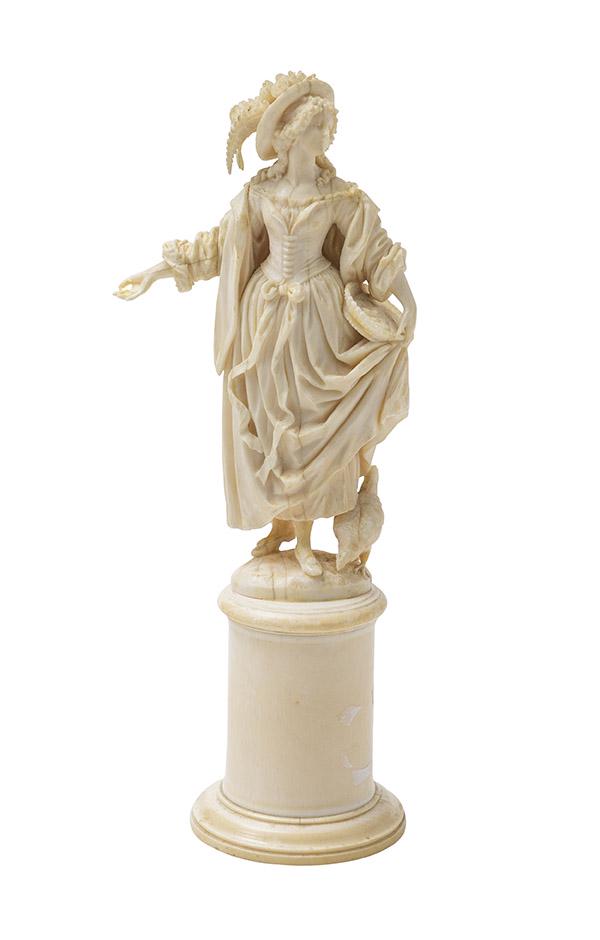 19th Century Finely Carved French Lady: Beautifully carved French lady in fine formal dress feeding her chick. She rests on round column base, Circa 1860. 3 1/2w x 2 1/2d x 9h.