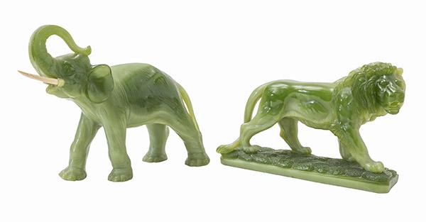 Green Jade Arcylic Elephant and Lion: Jade (Color) elephant with resin tusks and lion, Wony LTD. Italy. Elephant 12w x 4d x 9 3/8h, Lion 11w x 3 5/8d x 7 1/2h label to underside.