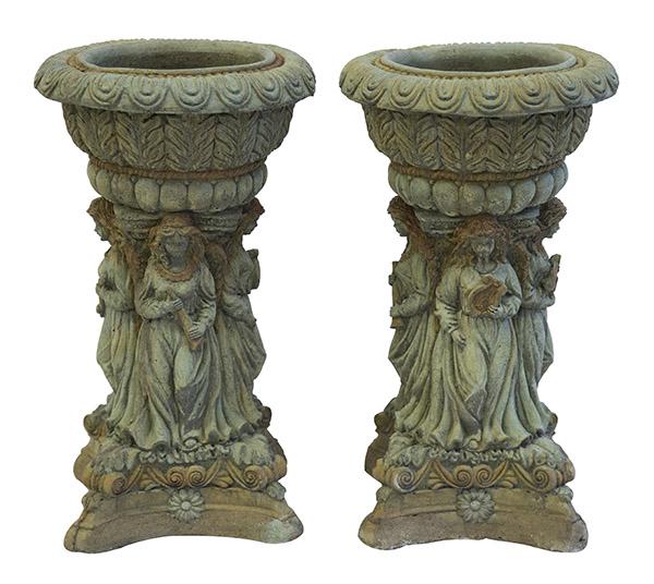 Pair of Gothic Revival Figural Planters: Round top with gadroon and beaded borders over an embossed acanthus leaf body resting on four embossed lady musicians raised on shaped pedestal bases with scrolled acanthus leaves and floral medallion