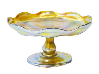Signed LCT Tiffany Tazza Compote: Tiffany iridescent art glass compote with scalloped edge, mounted on a stem and base. Signed L.C.T. Measures 6"dia x 3" h
