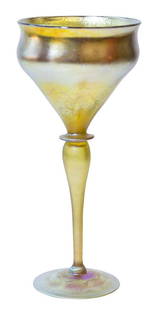 Signed LCT Tiffany Favrile Floriform Vase: Tiffany gold iridescent art glass floriform compote with stem and round base. Signed L.C.T. Favrile. Measures 8 1/2" H 3 3/4" Diameter