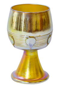 Signed LCT Tiffany Lily Pad Wine: Gold iridescent footed wine goblet signed L.C.T. Tiffany Favrile and numbered 3791. Applied gold Lily Pads over a treaded decoration on bell shaped base. 4 1/4" H x 2 1/4" Diameter