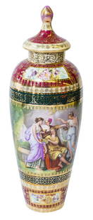 Royal Vienna Marked Austria Urn: Royal Vienna lidded urn stamped with blue beehive mark, Austria. Medallion scene of Kaufmann Grecian Ladies on front with red and gold decoration. 13" H x 4 1/2" Diameter