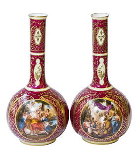 Pair Royal Vienna Victoria Austria Stick Vases: Pair of Royal Vienna bulbous stick form vases. Circa 1890. Decorated with gilt floral decoration on red background with medallion prints signed by Liebel. Marked on bottom with blue Beehive and